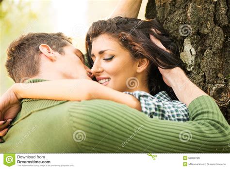 Kiss By The Tree stock photo. Image of kissing, handsome ...