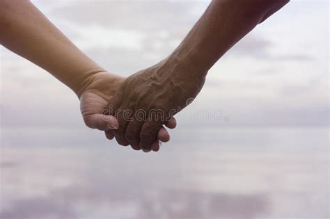 Close Up Hand Of Senior Couple Holding Hand Together Near ...